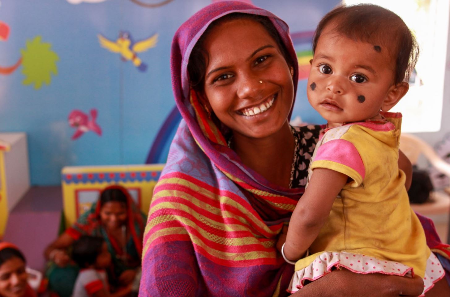 - Nutrition International woman and baby in Gujarat