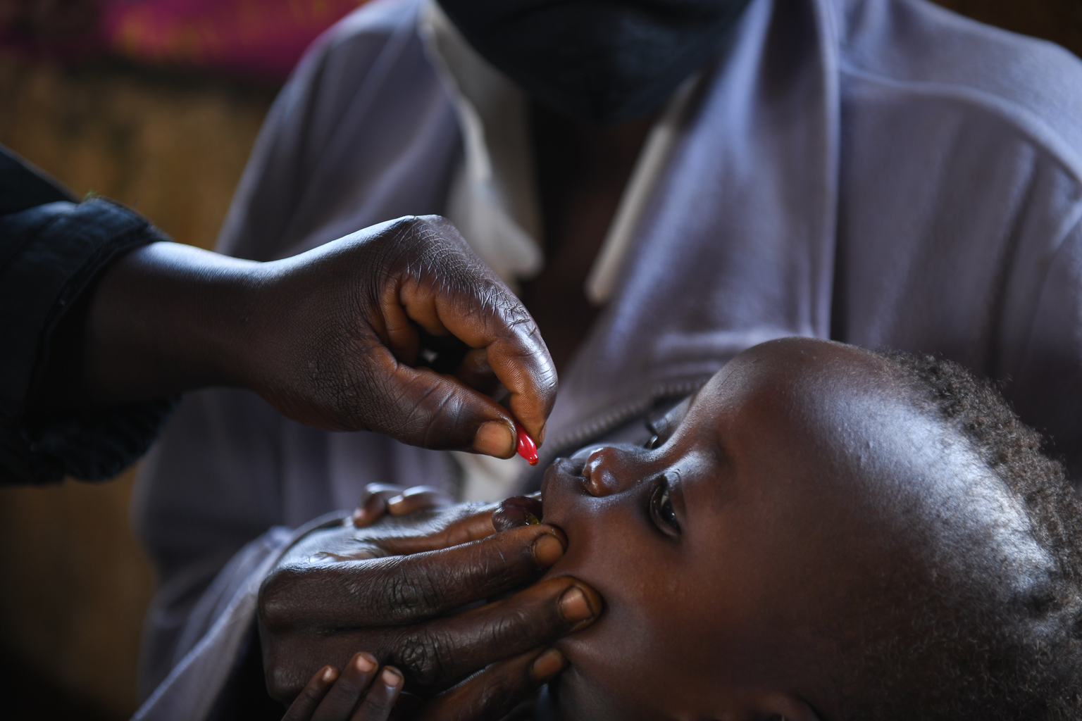 DSC_6558 - Nutrition International A child receives a vitamin A supplementation dose at a health clinic in Malawi