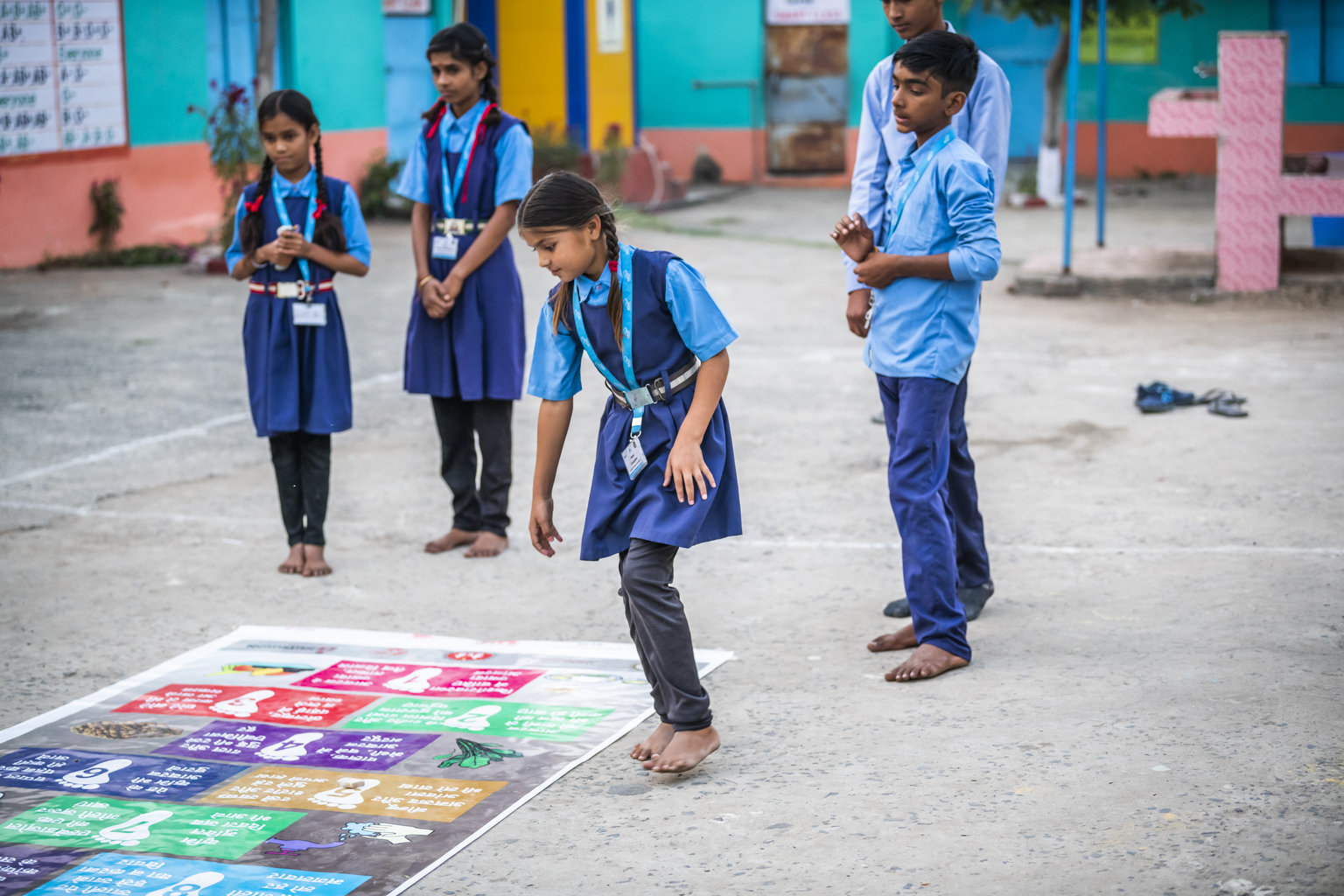 NI MP 2022 - Nutrition International A group of students play a game in the schoolyard
