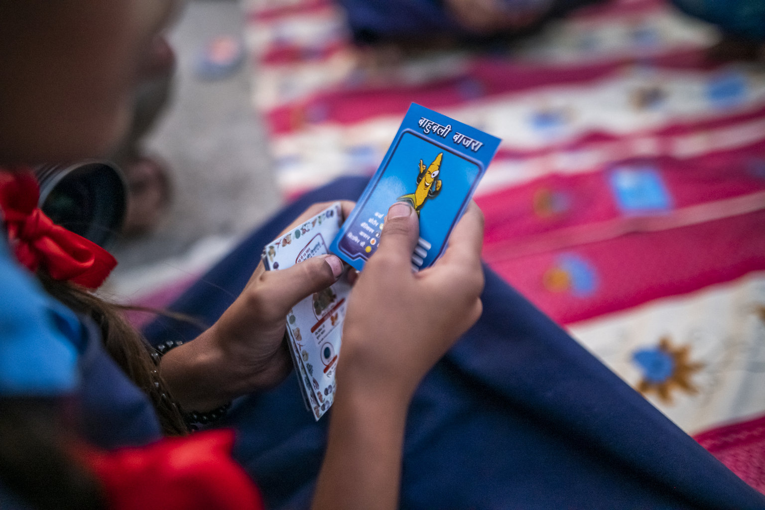 NI MP 2022 - Nutrition International Close-up of a game of Trump Cards