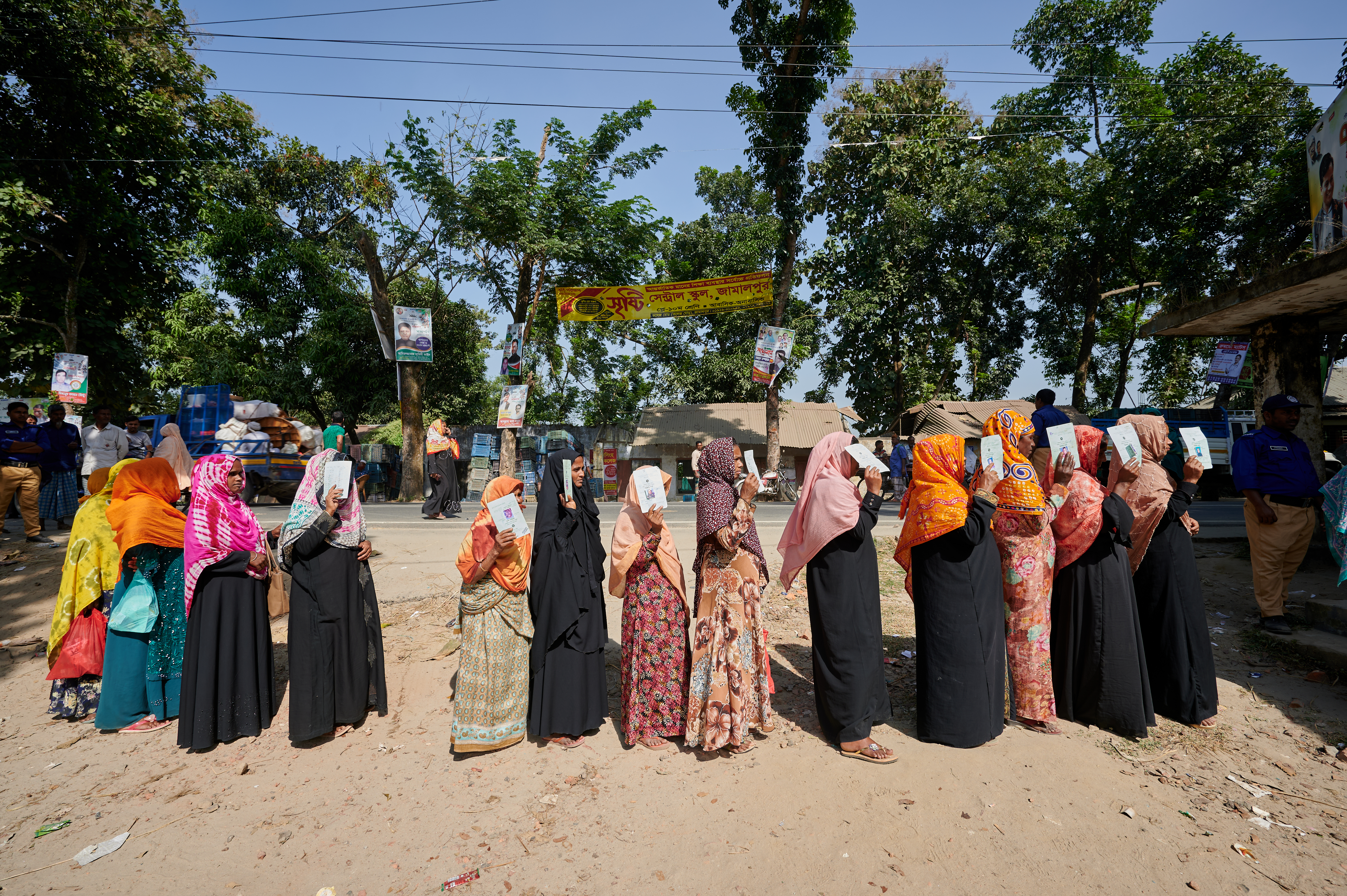 0158-NI-BD-21-11-2022-sujanmap - Nutrition International Women line up at a distribution point in Jamalpur District in Bangladesh to collect their packages of fortified rice.